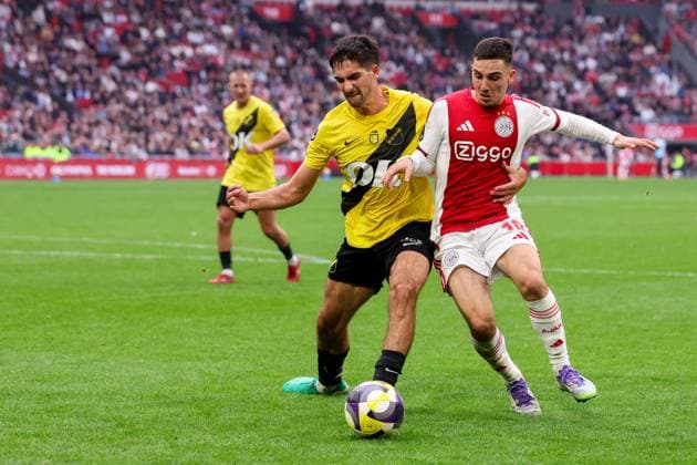 2025-09-27 AFC Ajax v NAC Breda - Dutch Eredivisie AMSTERDAM, NETHERLANDS - SEPTEMBER 27: Leo Greiml of NAC Breda, Oscar Gloukh of AFC Ajax during the Dutch Eredivisie match between AFC Ajax and NAC Breda at Johan Cruijff ArenA on September 27, 2025 in Amsterdam, Netherlands. Amsterdam Johan Cruijff ArenA Netherlands Content not available for redistribution in The Netherlands directly or indirectly through any third parties. Copyright: xBenxGalx