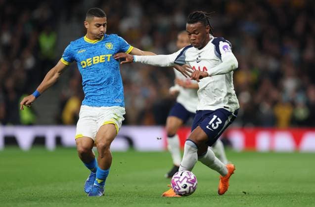 London, England, 27th September 2025. Andre of Wolverhampton Wanderers and Destiny Udogie of Tottenham Hotspur challenge for the ball during the Tottenham Hotspur vs Wolverhampton Wanderers Premier League match at the Tottenham Hotspur Stadium, London. Picture credit should read: Paul Terry Sportimage EDITORIAL USE ONLY. No use with unauthorised audio, video, data, fixture lists, club league logos or live services. Online in-match use limited to 120 images, no video emulation. No use in betting, games or single club league player publications. SPI_027_PT_Tottenham_Wolves SPI-4168-0027