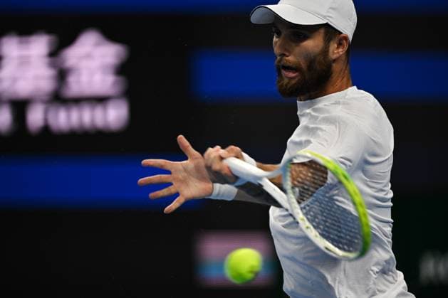 (250928) -- BEIJING, Sept. 28, 2025 -- Corentin Moutet returns a shot during the men s singles second round match between Corentin Moutet of France and Alexander Zverev of Germany at 2025 China Open tennis tournament in Beijing, China, Sept. 28, 2025. ) (SP)CHINA-BEIJING-TENNIS-CHINA OPEN-MEN S SINGLES-SECOND ROUND (CN) XinxMengchen 