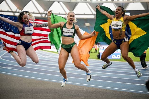 2025 World Para Athletics Championships, Jawaharlal Nehru Stadium, New Delhi, India 28 9 2025 Women™s 100m T13 Ireland™s Orla Comerford celebrates as she wins gold with United States™ Kym Crosby and Brazil™s Rayane Soares Da Silva Orla Comerford celebrates as she wins gold with Kym Crosby and Rayane Soares Da Silva 28 9 2025  Copyright: x INPHO NikolaxKrsticx 20250928TK155