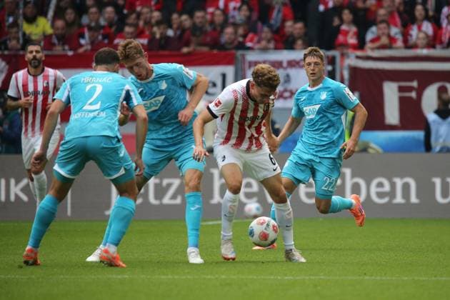 28.09.2025, xmohx, Fussball 1.Bundesliga, SC Freiburg - TSG Hoffenheim v.l. Robert Hranac (1899 Hoffenheim) Walter Burger (1899 Hoffenheim) Patrick Osterhage (SC Freiburg) Alexander Prass (1899 Hoffenheim) Zweikampf, Aktion, action, battle for the ball (DFL DFB REGULATIONS PROHIBIT ANY USE OF PHOTOGRAPHS as IMAGE SEQUENCES and or QUASI-VIDEO) Freiburg