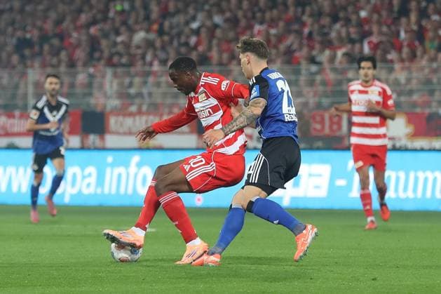 28.09.2025, xtgx, Fussball - 1.Bundesliga Union Berlin - Hamburger SV v.l. Ilyas Ansah (Union Berlin, 10), Nicolai Remberg (HSV, 21) Zweikampf, Duell, Kampf, tackle (DFL DFB REGULATIONS PROHIBIT ANY USE OF PHOTOGRAPHS as IMAGE SEQUENCES and or QUASI-VIDEO) Berlin