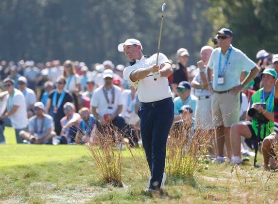 Rory McIlroy of Team Europe hits his second shot to the seventh hole during a singles match against Scottie Scheffler of Team United States on the final day of the 45th Ryder Cup at the Bethpage Black Course in Farmingdale, New York on Sunday, September 28, 2025. Europe has a 12 to 5 lead over the United States going into the final day.  RYD20250928913 COREYxSIPKIN