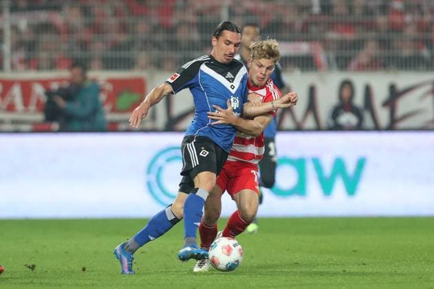 28.09.2025, xtgx, Fussball - 1.Bundesliga Union Berlin - Hamburger SV v.l. Rayan Philippe (HSV, 14), Andras Schaefer (Schäfer, Union Berlin, 13) Zweikampf, Duell, Kampf, tackle (DFL DFB REGULATIONS PROHIBIT ANY USE OF PHOTOGRAPHS as IMAGE SEQUENCES and or QUASI-VIDEO) Berlin