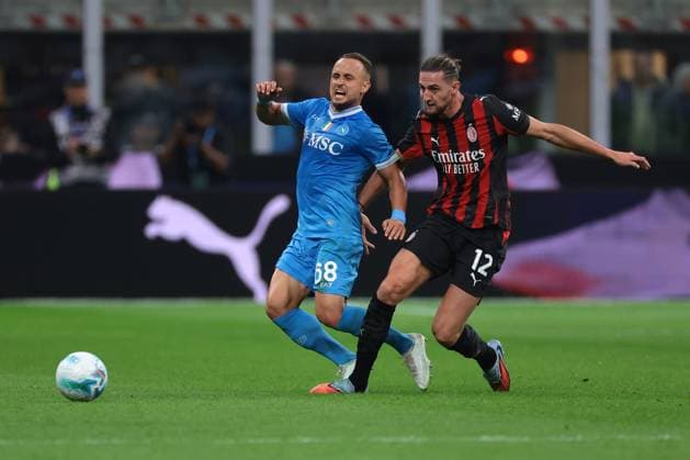 Milan, Italy, 28th September 2025. Adrien Rabiot of AC Milan makes a bad challenge on Stanislav Lobotka of SSC Napoli during the AC Milan vs Napoli Serie A match at Giuseppe Meazza, Milan. Picture credit should read: Jonathan Moscrop Sportimage EDITORIAL USE ONLY. No use with unauthorised audio, video, data, fixture lists, club league logos or live services. Online in-match use limited to 120 images, no video emulation. No use in betting, games or single club league player publications. SPI_040_JM_MILAN_NAPOLI SPI-4164-0040