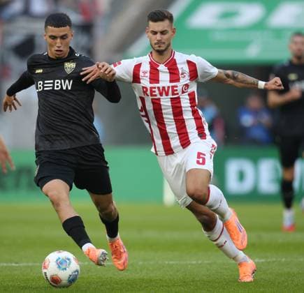 September 28, 2025, Koeln, Germany: Tom Krauss of FC Koeln and Bilal El Khannouss of VfB Stuttgart in action during the Bundesliga match between VfB Stuttgart and FC Koeln at RheinEnergie Stadion. Koeln Germany - ZUMAs197 20250928_aaa_s197_322 Copyright: xOsamaxFaisalx