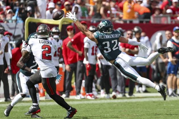 September 28, 2025, Tampa, Florida, USA: Tampa Bay Buccaneers wide receiver Emeka Egbuka 2 reaches for a pass as Philadelphia Eagles safety Reed Blankenship 32 attempts to block and is run for a touchdown in the third quarter on Sunday, Sept. 28, 2025 in Tampa. Tampa USA - ZUMAs70_ 20250928_zan_s70_083 Copyright: xLuisxSantanax Tampa USA - ZUMA0835 20250928_zan_s70_083 Copyright: xIMAGO LuisxSantanax