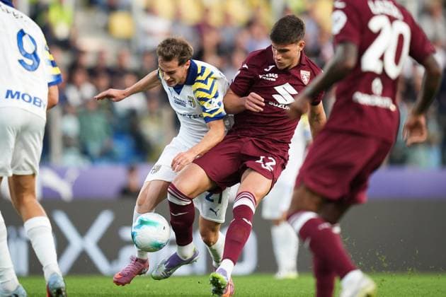 Parma s Enrico Del Prato and Torino s Nikola Vlasic with the card of FC26CopySwap during the Serie A soccer match between Parma and Torino at Ennio Tardini Stadium in Parma, North Italy, Monday, September 29, 2025. Soccer  Copyright: xMassimoxPaolone LaPressex