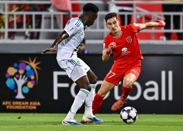 AFC CHAMPIONS LEAGUE ELITE, AL DUHAIL SC (QAT) V AL AHLI SAUDI FC (KSA) Adil Boulbina (R) of Al Duhail SC and Mohammed Sulaiman Bakor of Al Ahli Saudi FC in action during the AFC Champions League elite west football match between Qatar s Al Duhail SC and Saudi Arabia s Al Ahli Saudi FC at Abdullah Bin Khalifa Stadium in Doha, Qatar, on September 29, 2025. DOHA Qatar Copyright: xNAUSHADx