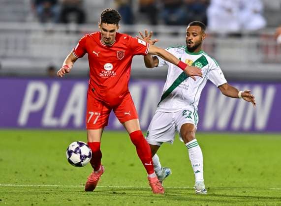 AFC CHAMPIONS LEAGUE ELITE, AL DUHAIL SC (QAT) V AL AHLI SAUDI FC (KSA) Adil Boulbina (L) of Al Duhail SC and ALI Hassan Majrashi of Al Ahli Saudi FC in action during the AFC Champions League elite west football match between Qatar s Al Duhail SC and Saudi Arabia s Al Ahli Saudi FC at Abdullah Bin Khalifa Stadium in Doha, Qatar, on September 29, 2025. DOHA Qatar Copyright: xNAUSHADx