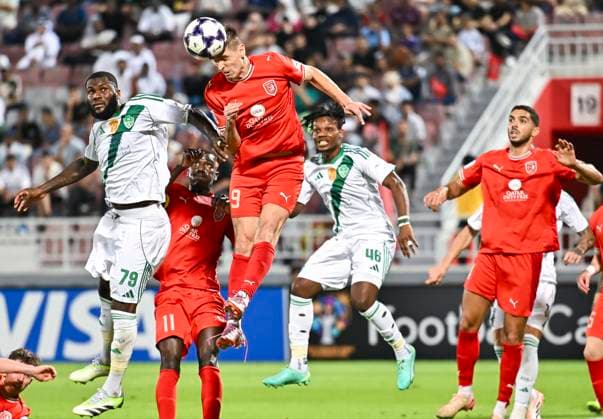 AFC CHAMPIONS LEAGUE ELITE, AL DUHAIL SC (QAT) V AL AHLI SAUDI FC (KSA) KRZYSZTOF PIATEK (top-R) of Al Duhail SC and Franck Kessie (L) of Al Ahli Saudi FC in action during the AFC Champions League elite west football match between Qatar s Al Duhail SC and Saudi Arabia s Al Ahli Saudi FC at Abdullah Bin Khalifa Stadium in Doha, Qatar, on September 29, 2025. DOHA Qatar Copyright: xNAUSHADx