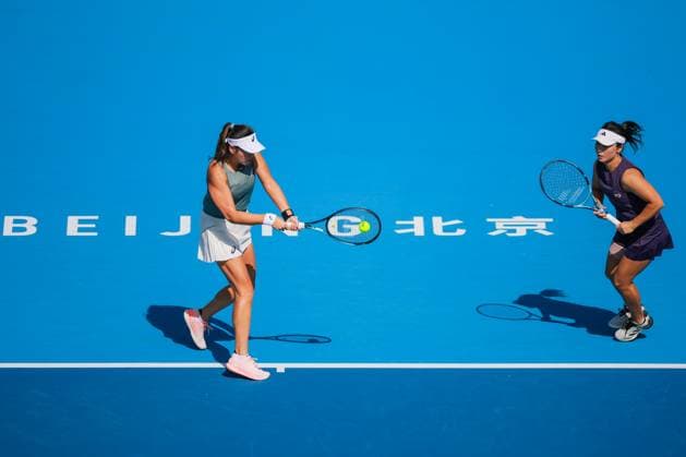 BEIJING, CHINA - SEPTEMBER 30: Xu Yifan and Yang Zhaoxuan of China return a shot in the Women s Doubles Round of 16 match against Timea Babos of Hungary and Luisa Stefani of Brazil on day 9 of the 2025 China Open at the National Tennis Center on September 30, 2025 in Beijing, China.  Copyright: xVCGx 111594164978