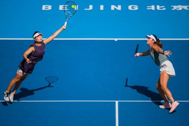 BEIJING, CHINA - SEPTEMBER 30: Xu Yifan and Yang Zhaoxuan of China return a shot in the Women s Doubles Round of 16 match against Timea Babos of Hungary and Luisa Stefani of Brazil on day 9 of the 2025 China Open at the National Tennis Center on September 30, 2025 in Beijing, China.  Copyright: xVCGx 111594165009