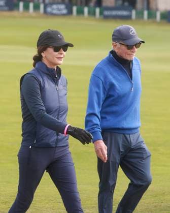 30th September 2025; The Old Course at St Andrews, Fife, Scotland; Alfred Dunhill Links Golf Championship, Practice Round; Actress Catherine Zeta-Jones and her husband Actor Michael Douglas walk down the first hole of the Old Course, St Andrews during a practice round at the Alfred Dunhill Links Championship  DavidxYoung