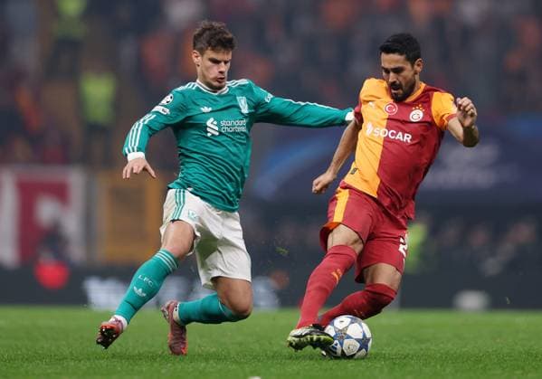 Ilkay Gündogan of Galatasaray is challenged by Milos Kerkez of Liverpool Galatasaray v Liverpool, UEFA Champions League, Group Stage, Football, RAMS Park, Istanbul, Turkey - 30 Sep 2025Istanbul RAMS Park Turkey EDITORIAL USE ONLY No use with unauthorised audio, video, data, fixture lists, club league logos or live services. Online in-match use limited to 120 images, no video emulation. No use in betting, games or single club league player publications. Copyright: xRaddadxJebarah Shutterstockx 15504034bi