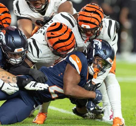 September 30, 2025, Denver, Colorado, USA: Broncos RB TYLER BADIE gets tackled by the Bengal Defense during the 2nd Half at Empower Field at Mile High Monday night. Broncos beat the Bengals 28-3. Denver USA - ZUMAav4_ 20250930_zaf_av4_032 Copyright: xHectorxAcevedox