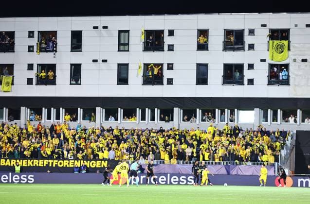 Fans of Bodo Glimt watching from a stadiums building windows FK Bodo Glimt v Tottenham Hotspur, UEFA Champions League, Group Stage, Football, Aspmyra Stadion, Bodo, Norway - 30 Sep 2025Bodo Aspmyra Stadion Norway EDITORIAL USE ONLY No use with unauthorised audio, video, data, fixture lists, club league logos or live services. Online in-match use limited to 120 images, no video emulation. No use in betting, games or single club league player publications. Copyright: xMichaelxZemanek Shutterstockx 15504026bb