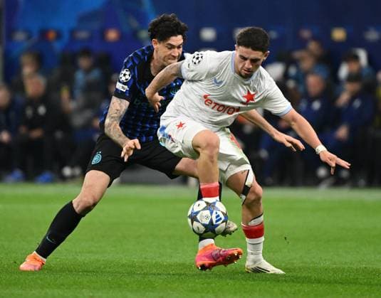 (251001) -- MILAN, Oct. 1, 2025 -- Inter Milan s Alessandro Bastoni (L) vies with Salvia Praha s Christos Zafeiris during the UEFA Champions League match between Inter Milan and Slavia Praha in Milan, Italy, Sept.30, 2025. (SP)ITALY-MILAN-FOOTBALL-UEFA CHAMPIONS LEAGUE-INTER MILAN VS SLAVIA PRAHA LixJing 