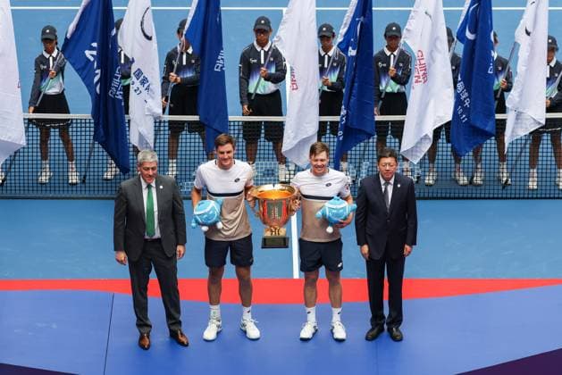 BEIJING, CHINA - OCTOBER 01: Henry Patten of Great Britain and Harri Heliovaara of Finland pose with the trophy during the medal ceremony following the Men s Doubles Final match against Karen Khachanov and Andrey Rublev on day 10 of the 2025 China Open at the National Tennis Center on October 1, 2025 in Beijing, China.  Copyright: xVCGx 111594381703