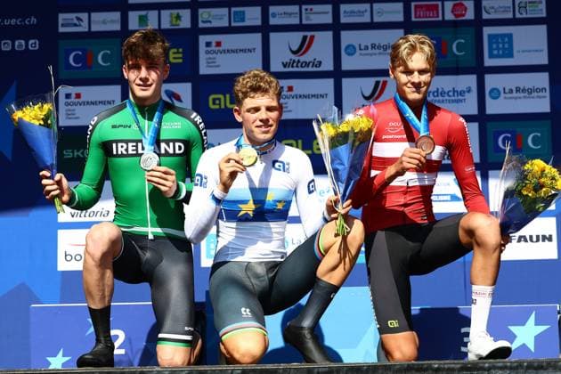 Irish Conor Murphy, Dutch Michiel Mouris and Danish Lovstrup Julius Birkedal celebrate on the podium after the 24 km time trial of the men junior category at the UEC road European cycling championships, Wednesday 01 October 2025, in Loriol-sur-Drome, France. The European cycling championships Drome-Ardeche takes place from 1 to 5 October, France. DAVIDxPINTENS  x135808368x