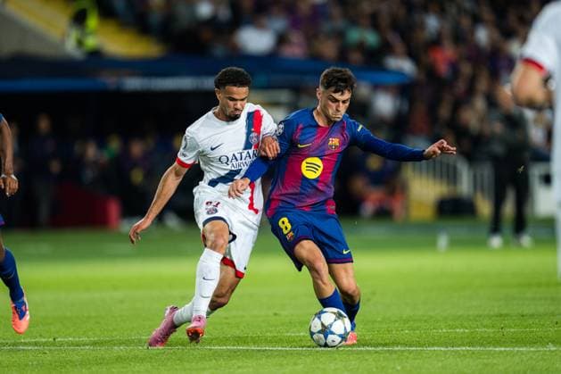 Spain-Football-Champions League-Group Stage FC Barcelona, Barca v PSG in Barcelona, Spain. Barcelona, Spain, 1, October, 2025. FC Barcelona player (8) Pedri vies with (33) Warren Zaire-Emery during Champions League match between FC Barcelona and PSG in Olympic Stadium Lluis Companys, Barcelona, Spain, on October 1, 2025. Barcelona Olympic Stadium Lluis Companys Barcelona Spain