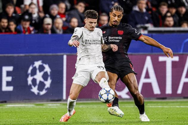 Dennis Man of PSV Eindhoven battles for possession with Loic Bade of Bayer 04 Leverkusen Bayer 04 Leverkusen v PSV Eindhoven, UEFA Champions League 2025 26 League Phase MD2, Bayer 04 Leverkusen v PSV Eindhoven, BayArena, October 1, 2025, Leverkusen, Germany.