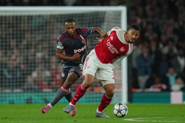 Ayoub El Kaabi of Olympiakos and William Saliba of Arsenal Arsenal v Olympiakos, UEFA Champions League, Group Stage, Football, Emirates Stadium, London, UK - 01 Oct 2025London Emirates Stadium United Kingdom EDITORIAL USE ONLY No use with unauthorised audio, video, data, fixture lists, club league logos or live services. Online in-match use limited to 120 images, no video emulation. No use in betting, games or single club league player publications.  Copyright: xJoexToth Shutterstockx 15504044aa
