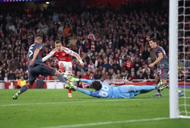 London, England, 1st October 2025. Leandro Trossard of Arsenal has a shot saved during the Arsenal vs Olympiacos UEFA Champions League match at the Emirates Stadium, London. Picture credit should read: David Klein Sportimage EDITORIAL USE ONLY. No use with unauthorised audio, video, data, fixture lists, club league logos or live services. Online in-match use limited to 120 images, no video emulation. No use in betting, games or single club league player publications. SPI_040_DK_Arsenal_Olympiakos SPI-4186-0041