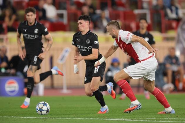 Monaco, Monaco, 1st October 2025. Phil Foden of Manchester City takes on Eric Dier of AS Monaco during the AS Monaco vs Manchester City UEFA Champions League match at Stade Louis II, Monaco. Picture credit should read: Jonathan Moscrop Sportimage EDITORIAL USE ONLY. No use with unauthorised audio, video, data, fixture lists, club league logos or live services. Online in-match use limited to 120 images, no video emulation. No use in betting, games or single club league player publications. SPI_103_JM_MONACO_MANCITY_UCL_ SPI-4166-0103