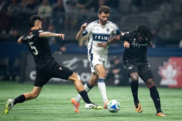 October 1, 2025, Vancouver, Bc, CANADA: Vancouver FC s Matteo Campagna, left, Kunle Dada-Luke, right and Vancouver Whitecaps Thomas Muller, centre, vie for the ball during the first half of the Canadian Championship final soccer match, in Vancouver, on Wednesday, October 1, 2025. Canada News - October 1, 2025 - ZUMAc35_ 20251001_zaf_c35_181 Copyright: xEthanxCairnsx