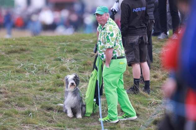 2nd October 2025; The Carnoustie Golf Links, Carnoustie, Angus, Scotland; Alfred Dunhill Links Golf Championship, Round One; A colourful dress ed fan and his dod watch the golf on Carnoustie Championship golf course during the first round of the Alfred Dunhill Links Championship  DavidxYoung