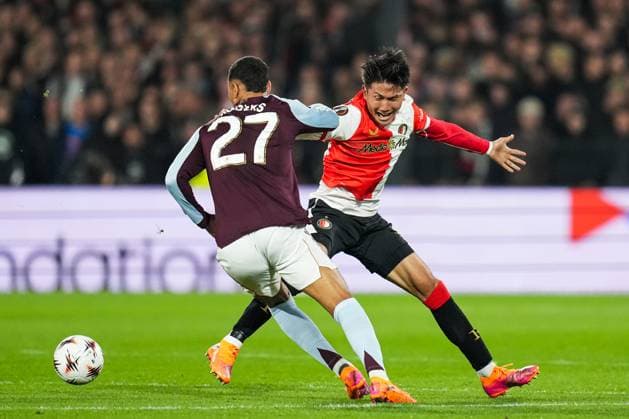 UEFA Europa League: Feyenoord Rotterdam v Aston Villa F.C. Rotterdam - Morgan Rogers of Aston Villa, Tsuyoshi Watanabe of Feyenoord during the second match of the UEFA Europa League 2025 2026. The match is set between Feyenoord Rotterdam and Aston Villa F.C. at Stadion Feijenoord De Kuip on 2 October 2025 in Rotterdam, The Netherlands. Copyright: xYannickxVerhoevenx