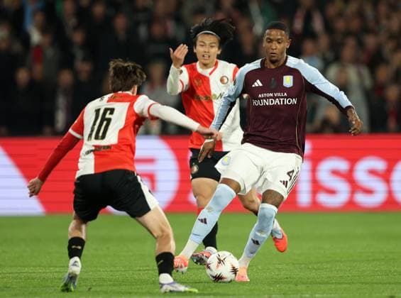 Ezri Konsa of Aston Villa in action against Leo Sauer of Feyenoord Feyenoord v Aston Villa, UEFA Europa League, Group Stage, Football, De Kuip, Rotterdam, Netherlands - 02 Oct 2025Rotterdam De Kuip Netherlands EDITORIAL USE ONLY No use with unauthorised audio, video, data, fixture lists, club league logos or live services. Online in-match use limited to 120 images, no video emulation. No use in betting, games or single club league player publications. Copyright: xBartxStoutjesdijk Shutterstockx 15504059u