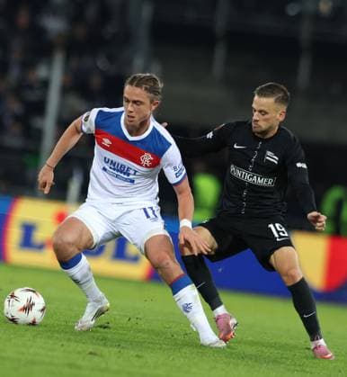 Thelo Aasgaard of Rangers and Tomi Horvat of SK Sturm Graz during UEFA Europa League league phase match at Merkur Arena, Graz. SK Sturm Graz v Rangers - UEFA Europa League - League Phase - Merkur Arena, Styria, Austria - 02 Oct 2025Graz Merkur Arena Styria Australia EDITORIAL USE ONLY  Copyright: xRangersxFC Shutterstockx 15514837et