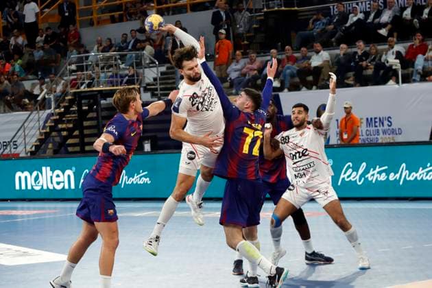 (251003) -- CAIRO, Oct. 3, 2025 -- Nedim Remili (top) of Veszprem HC shoots during the final match of the 18th IHF Men s Club World Championship, WM, Weltmeisterschaft 2025 between Veszprem HC of Hungary and FC Barcelona, Barca of Spain in Cairo, Egypt, on Oct. 2, 2025. ) (SP)EGYPT-CAIRO-HANDBALL-IHF MEN S CLUB WORLD CHAMPIONSHIP-FINAL AhmedxGomaa 