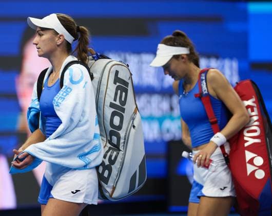 (251003) -- BEIJING, Oct. 3, 2025 -- Tereza Mihalikova Olivia Nicholls (L) leave the court after the women s doubles quarterfinal match between Hsieh Su-Wei (Chinese Taipei) Jelena Ostapenko (Latvia) and Tereza Mihalikova (Slovakia) Olivia Nicholls (Britain) at 2025 China Open tennis tournament in Beijing, China, Oct. 3, 2025. (Photo by Xinhua) (SP)CHINA-BEIJING-TENNIS-CHINA OPEN-WOMEN S DOUBLES-QUARTERFINAL (CN) MaxZihan 