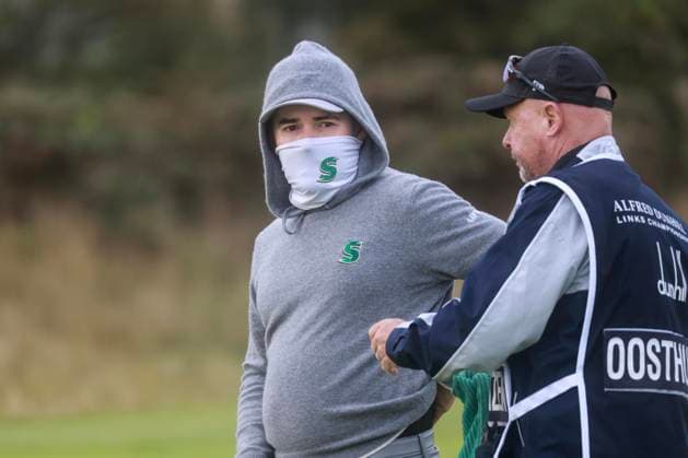 3rd October 2025; Kingsbarns Golf Links, St Andrews, Fife, Scotland; Alfred Dunhill Links Golf Championship, Round Two; Louis Oosthuizen of South Africa wrapped up agains the early morning cold at Kingsbarns Golf Links during the second round of the Alfred Dunhill Links Championship  DavidxYoung