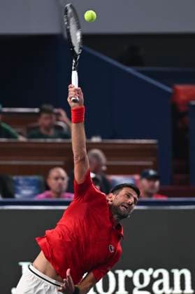 (251003) -- SHANGHAI, Oct. 3, 2025 -- Novak Djokovic serves during the men s singles round of 64 match between Novak Djokovic of Serbia and Borna Coric of Croatia at the ATP, Tennis Herren World Tour Shanghai Masters tennis tournament in Shanghai, east China, Oct. 3, 2025. ) (SP)CHINA-SHANGHAI-TENNIS-ATP TOUR-SHANGHAI MASTERS-MEN S SINGLES (CN) ChenxHaoming 
