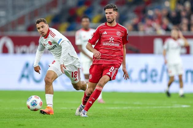 03.10.2025, Fußball, Fortuna Düsseldorf - 1.FC Nürnberg, 2. Fußball Bundesliga, Merkur Spiel-Arena, Saison 2025 2026: Rafael Lubach (1FC Nuernberg 18) im Zweikampf gegen Anouar El Azzouzi (Fortuna Düsseldorf 08) DFB regulations prohibit any use of photographs as image sequences and or quasi-video. Nordrhein-Westfalen Deutschland