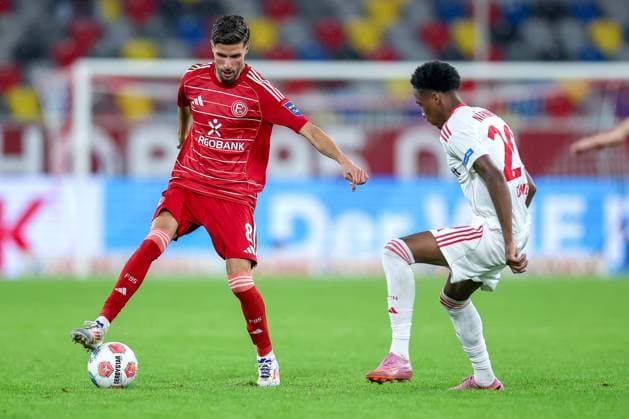03.10.2025, Fußball, Fortuna Düsseldorf - 1.FC Nürnberg, 2. Fußball Bundesliga, Merkur Spiel-Arena, Saison 2025 2026: Anouar El Azzouzi (Fortuna Düsseldorf 08) im Zweikampf gegen Pape Demba Diop (1FC Nuernberg 20) DFB regulations prohibit any use of photographs as image sequences and or quasi-video. Nordrhein-Westfalen Deutschland