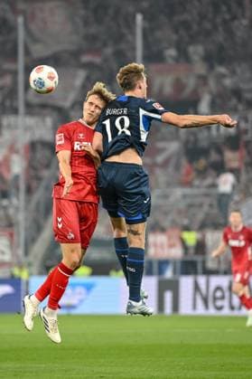 Timo Hübers (1. FC Köln) und Wouter Burger (1899 Hoffenheim) im Zweikampf waehrend des spiels der Bundesliga zwischen TSG Hoffenheim und 1. FC Köln, PreZero Arena am 03. October 2025 in Sinsheim, Deutschland. (Foto von Harry Langer DeFodi Images) +++ Timo Hübers (1. FC Köln) und Wouter Burger (1899 Hoffenheim) battle for the ball during the Bundesliga match between TSG Hoffenheim and 1. FC Köln at PreZero Arena on October 3, 2025 in Sinsheim, Germany. (Photo by Harry Langer DeFodi Images) DFL regulations prohibit any use of photographs as image sequences and or quasi-video. (Photo by Harry Langer DeFodi Images) DFL regulations prohibit any use of photographs as image sequences and or quasi-video. Timo Hübers 1 FC Köln and Wouter Burger 1899 Hoffenheim in a duel during the Bundesliga match between TSG Hoffenheim and 1 FC Köln, PreZero Arena on 03 October 2025 in Sinsheim, Germany Photo by Harry Langer DeFodi Images Timo Hübers 1 FC Köln and Wouter Burger 1899 Hoffenheim battle for the ball during the Bundesliga match between TSG Hoffenheim and 1 FC Köln at PreZero Arena on October 3, 2025 in Sinsheim, Germany Photo by Harry Langer DeFodi Images DFL regulations prohibit any use of photographs as image sequences and or quasi video Photo by Harry Langer DeFodi Images DFL regulations prohibit any use of photographs as image sequences and or quasi video