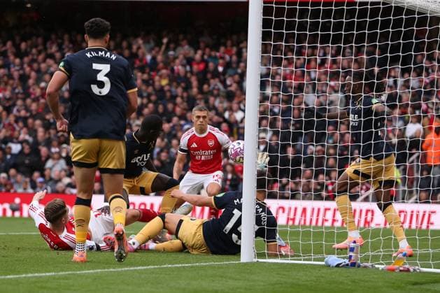4th October 2025; Emirates Stadium, London, England; Premier League Football, Arsenal versus West Ham United; goalkeeper Alphonse Areola of West Ham United parries the ball away while on the ground during a goal mouth scramble  KatiexChan