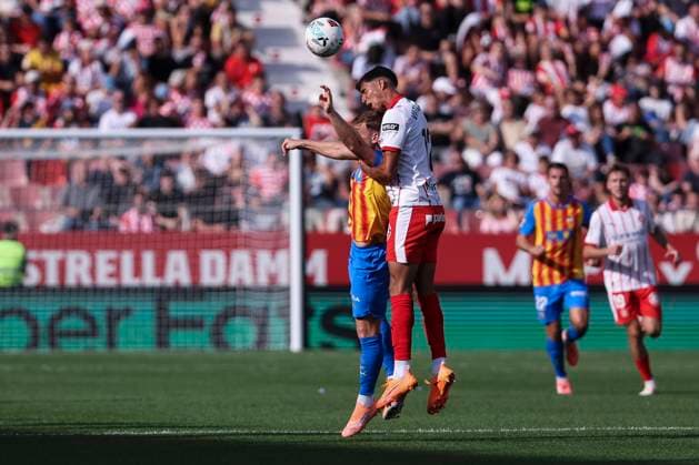 October 4, 2025, Girona, Girona, SPAIN: Vitor Reis of Girona FC and Dani Raba of Valencia CF compete for the ball during the Spanish league, La Liga EA Sports, football match played between Girona FC and Valencia CF at Montilivi stadium on October 04, 2025 in Girona, Spain. Girona SPAIN - ZUMAa181 20251004_zaa_a181_045 Copyright: xJavierxBorregox