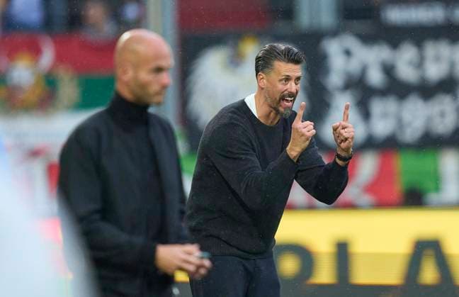 Head coach Sandro Wagner of Augsburg, team manager next to Head coach Paul Simonis of Wolfsburg in the match FC AUGSBURG - VFL WOLFSBURG on October 4, 2025 in WWK Arena Augsburg, Germany. Season 2025 2026, 1.Bundesliga, FCB, matchday 6, 6.Spieltag