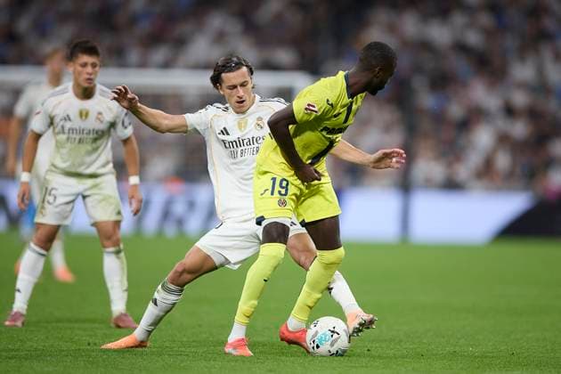 Nicolas Pepe (Villarreal CF) and Alvaro Carreras (Real Madrid CF) battle for the ball during the LaLiga EA Sports match between Real Madrid v Villarreal CF at Santiago BernabÃ u on October 4, 2025 in Madrid, Spain. (Photo by Manu Reino DeFodi Images) Nicolas Pepe Villarreal CF and Alvaro Carreras Real Madrid CF battle for the ball during the LaLiga EA Sports match between Real Madrid v Villarreal CF at Santiago BernabÃ u on October 4, 2025 in Madrid, Spain Photo by Manu Reino DeFodi Images