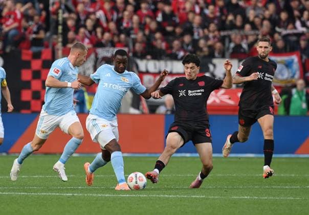 Tim Skarke (Union Berlin), Ilyas Ansah (Union Berlin), Ibrahim Maza (Bayer 04 Leverkusen), Robert Andrich (Bayer 04 Leverkusen), v.li. 04.10.2025, Fussball 1. Bundesliga, Saison 2025 2026, 6. Spieltag, Bayer 04 Leverkusen - Union Berlin 2:0 DFL regulations prohibit any use of photographs as image sequences and or quasi-video Leverkusen BayArena Nordrhein Westfalen Deutschland
