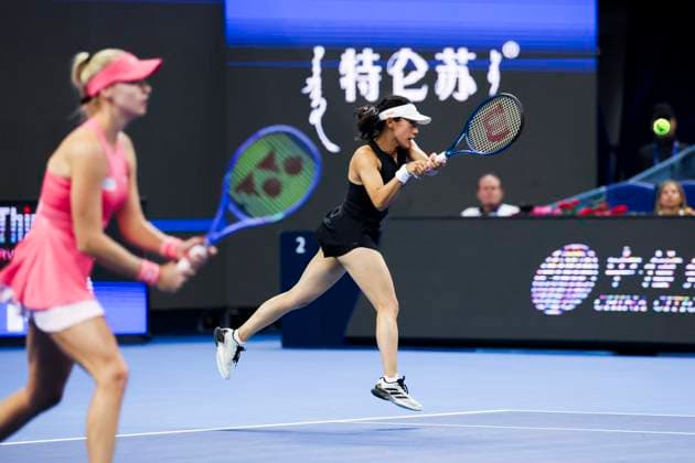 BEIJING, CHINA - OCTOBER 05: Miyu Kato of Japan and Fanny Stollar of Hungary return a shot in the Women s Doubles Final match against Sara Errani and Jasmine Paolini of Italy on day 14 of the 2025 China Open at the National Tennis Center on October 5, 2025 in Beijing, China.  Copyright: xVCGx 111595191384