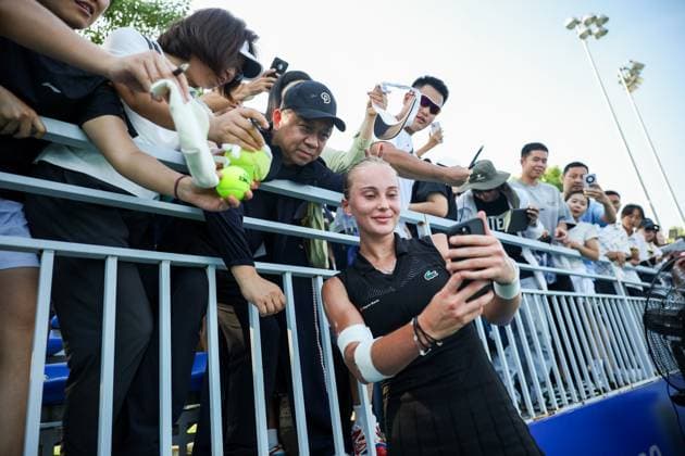 WUHAN, CHINA - OCTOBER 05: Polina Kudermetova takes a selfie with fans after the Women s Singles Qualifying second round match against Viktoriya Tomova of Bulgaria on day 2 of 2025 Wuhan Open at Optics Valley International Tennis Center on October 5, 2025 in Wuhan, Hubei Province of China.  Copyright: xVCGx 111595195941