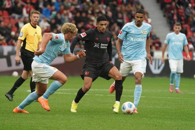 Fussball, 1 Bundesliga, Saison 2025 2026, Bayer 04 Leverkusen- 1.FC Union Berlin 04.10.2025, Bayarena Leverkusen Leopold Querfeld, Union Berlin, Ezequiel Fernandez, Bayer 04, Danilho Doekhi, 1.FC Union Berlin ,
