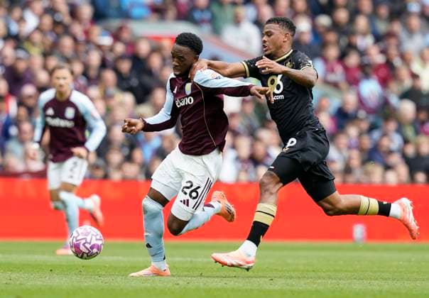 Birmingham, England, 5th October 2025. Lamare Bogarde of Aston Villa (L) is challenged by Lyle Foster of Burnley during the Aston Villa vs Burnley Premier League match at Villa Park, Birmingham. Picture credit should read: Andrew Yates Sportimage EDITORIAL USE ONLY. No use with unauthorised audio, video, data, fixture lists, club league logos or live services. Online in-match use limited to 120 images, no video emulation. No use in betting, games or single club league player publications. SPI_007_VILLA_BURNLEY SPI-4198-0006
